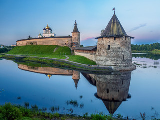 Pskov Ancient Citadel At The Bank Of A River At Dawn In Summer