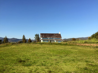Obraz premium View of a farmhouse in summer