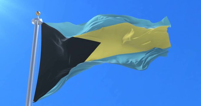 Bahamas flag waving at wind in slow with blue sky, loop