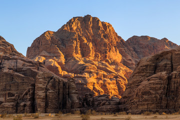 View of the yellow colored mountain rocks in the Wadi rum desert in Jordan at early-morning