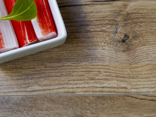 Surimi in a recipe on wood background with space for text