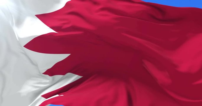Bahrain flag waving at wind in slow with blue sky, loop
