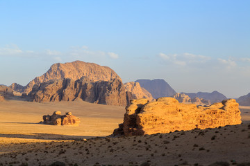 Fototapeta na wymiar Scenic view of the yellow colored mountain rocks in the Wadi rum desert in Jordan at early-morning