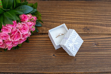 Flowers and ring as a gift. Proposal. Conception holiday, Valentine's Day, 8 March.