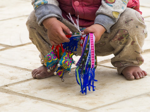 Unidentifed Kid Selling Souvenirs - Child Exploitation Concept - Responsible Tourism