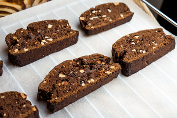 emade chocolate biscotti cookies with almonds on parchment paper