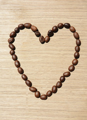 Coffee beans organized in heart shape