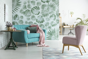 Blue couch in botanic interior - obrazy, fototapety, plakaty