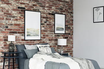 Paintings in cozy bedroom