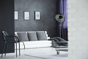 Metal designer chair in room