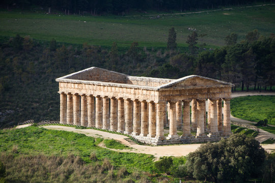 Summer landscape with ancient Greek temple of Venus, Segesta village, Sicily, Italy.