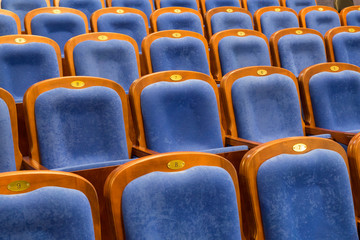 Fototapeta premium Blue brown wooden chairs in the auditorium. Without people.