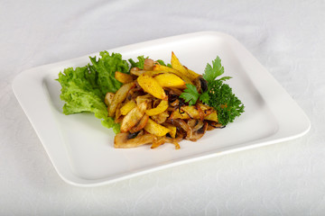 Fried potato with mushrooms