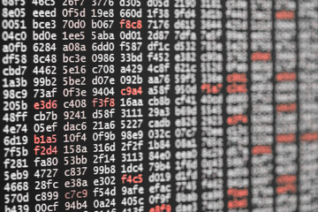 Abstract background texture of code with white and red digits.