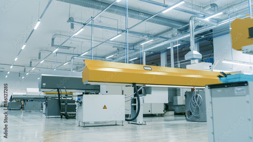 Poster shot of the high-tech modern electronics manufacturing factory full of computerized automatic machin