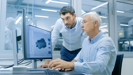 Industrial Designer Has Conversation with Senior Engineer While Working in CAD Program, Designing...