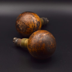 Antique Doorknobs Arranged on a Seamless Black Background
