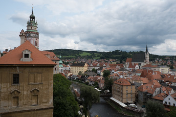 View of the charming medieval town, Cesky Krumlov, from the castle. Renaissance Castle Tower, St Vitus Church, looking down on village and the Vltava River running through the town.