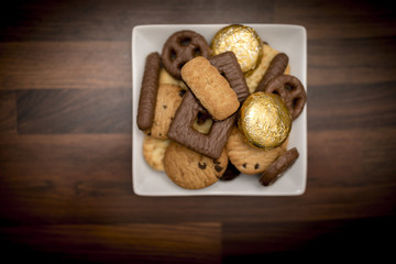 Delicious, yummy and luxurious bowl of luxury biscuits including a selction of chocolate chip shortbread cookies, chocolate digestives and orange creme biscuits
