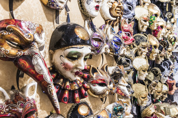 Venetian carnival masks in the wall of a shop in Venice, Veneto, Italy