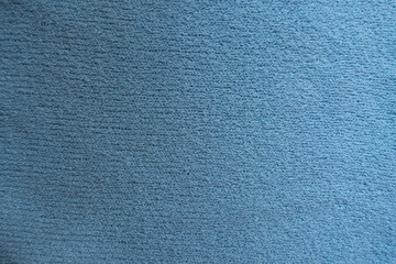Surface of simple sky blue fabric from above