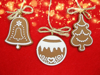christmas cookies gingerbread and decoration on red background