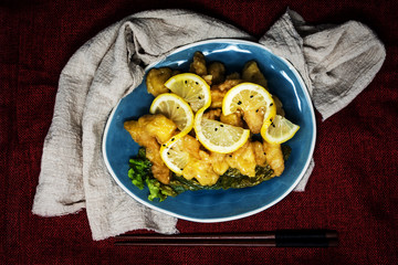 Chinese food fried fish and lemon slices