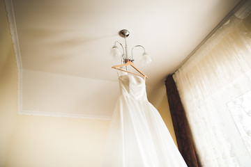 The perfect wedding dress in the room of the bride