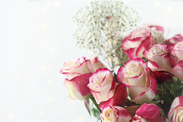 Beautiful bouquet of red and white roses with baby's breath. Selective focus with shallow depth of field.