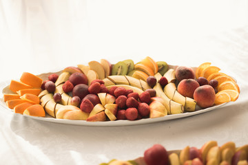 Various sweet sliced fruit on a buffet table