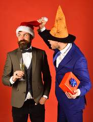 Businessmen with curious faces pose on holiday party
