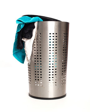 Dirty laundry in a metal basket