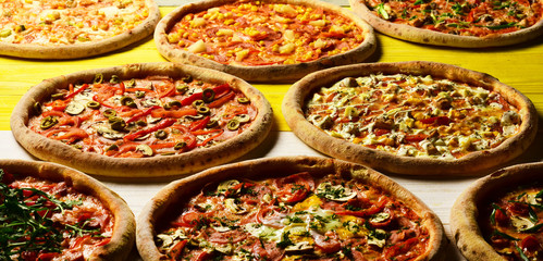 Fototapeta na wymiar Fast food restaurant concept. Different pizzas set for menu
