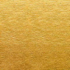 Gold foil texture. Golden wall background close-up - 186138036