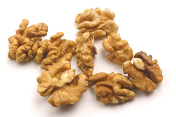 Peeled walnuts close-up on a white background