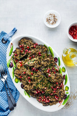 Vegan salad of lentils and eggplant grilled with pomegranate seeds and parsley. healthy food