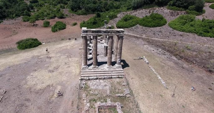 SARDINIA, ITALY  &ndash; JULY 2016 : Aerial shot of Temple of Antas on a beautiful day with woman and amazing landscape in view