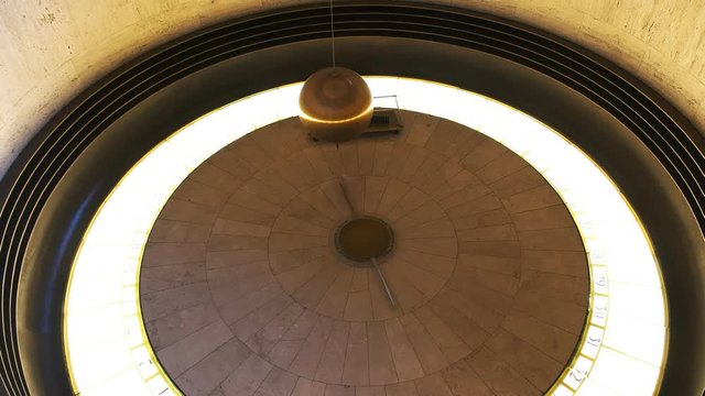 close up of the foucault pendulum at griffith observatory, a foucault pendulum is designed to demonstrate the rotation of the earth