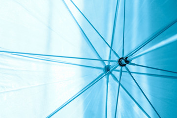 blue abstract background, umbrella spokes, rays. Concept for computer background