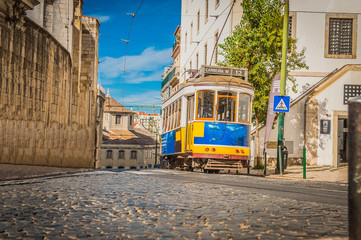 Yellow tram 28 on streets of Lisbon, Portugal
