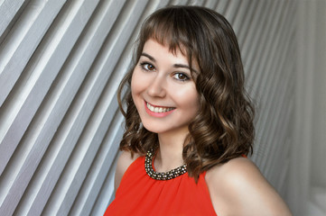 Brunette girl smiling on white background