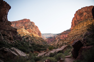 Fototapeta premium Landscape view in the Grand Canyon, Arizona with a waterfall, river, and valley walls. 