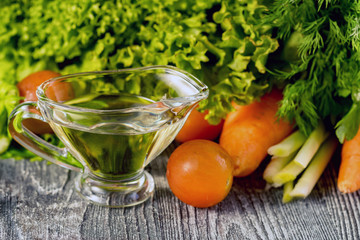 Healthy diet, jug of olive oil and vegetables