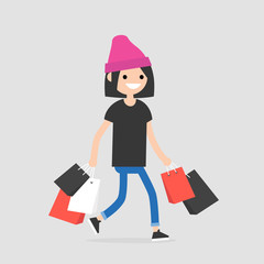 Young trendy female character walking with the shopping bags / flat editable vector illustration