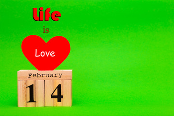 Happy Valentines Day card with red paper heart and wooden calendar on green background