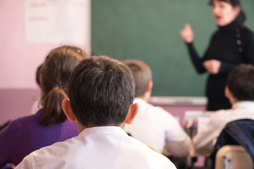 children actively participate in the class, read and listen to the teacher