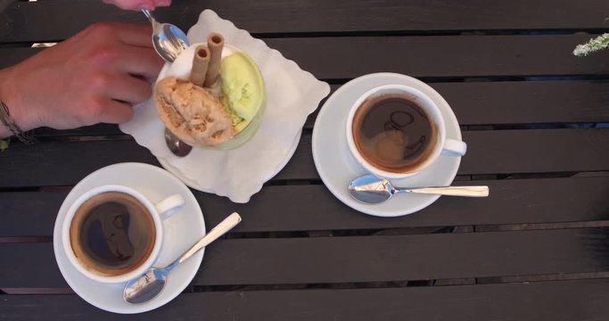 ALGHERO, SARDINIA, ITALY  – JULY 2016 : Video shot of coffee and ice cream on a sunny day in local café