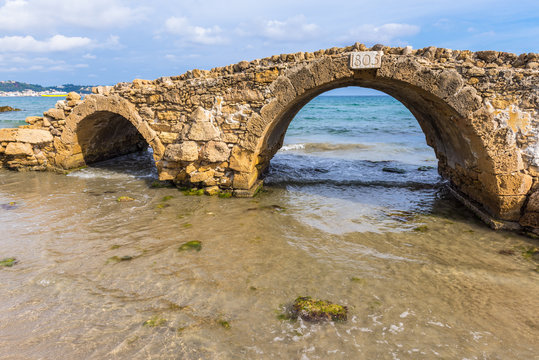 The Venetian Bridge of Argassi in Zakynthos. The bridge is a sightseeing location that many tourists visit. Zakynthos island in Greece, Ionian Sea.