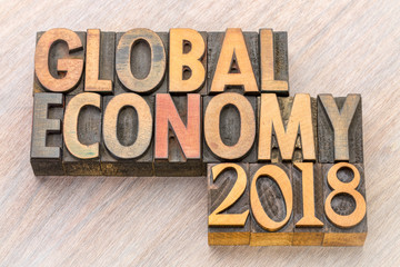 global economy 2018 word abstract in wood type