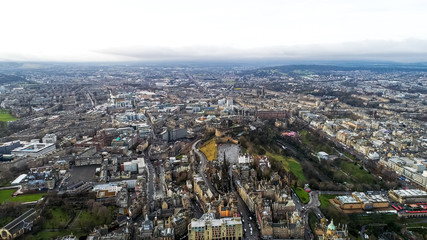 Fototapeta na wymiar Aerial View of Edinburgh City Town Center feat. Iconic Scottish Landmarks such as Edinburgh Castle, National Museum, The University of Edinburgh, Rail Station Cityscape in Scotland UK